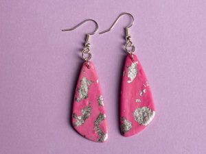 A pair of pink earrings made from Fimo