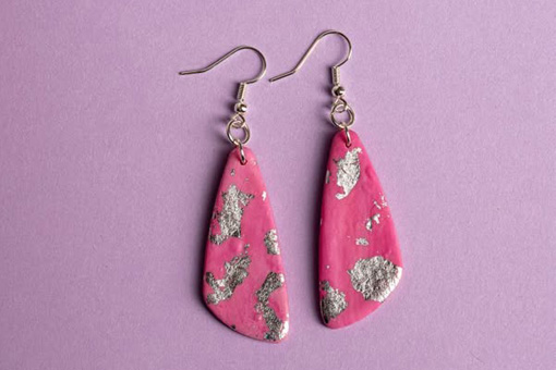 A pair of pink earrings made from Fimo