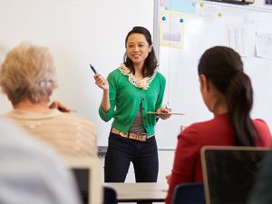 Woman teaching a class of learners