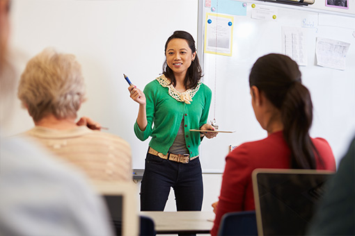 Woman teaching a class of learners