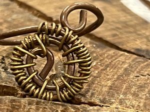 Wire Bead ring on a wooden surface